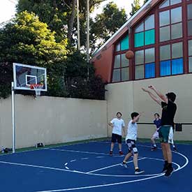 UNRC-exterior basketball court play